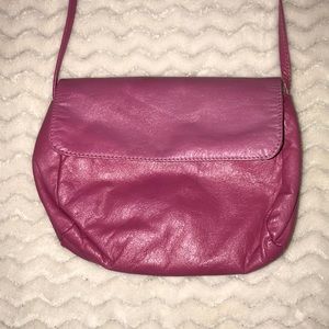 A pink faux leather purse